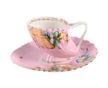 A RUSSIAN PORCELAIN TEACUP AND SAUCER, M, S. KUZNETSOV, CIRCA 1900
