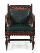 A VICTORIAN CARVED OAK AND LEATHER UPHOLSTERED ARMCHAIR, IN GOTHIC REVIVAL STYLE, 19TH CENTURY