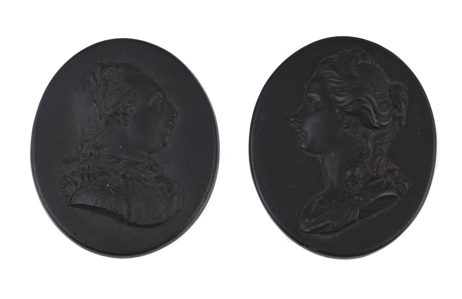 A PAIR OF WEDGWOOD OVAL PORTRAIT PLAQUES OF KING GEORGE III AND QUEEN CHARLOTTE, CIRCA 1800