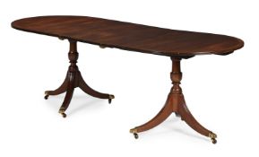 A MAHOGANY EXTENDING DINING TABLE, BY 'G T RACKSTRAW LTD', 20TH CENTURY