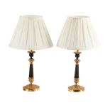 A PAIR OF BRONZE AND GILT CANDLESTICK LAMPS, MID 19TH CENTURY