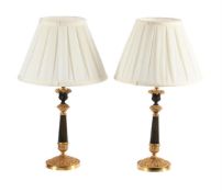 A PAIR OF BRONZE AND GILT CANDLESTICK LAMPS, MID 19TH CENTURY