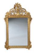 A CARVED GILTWOOD MIRROR, IN LOUIS XVI STYLE, 20TH CENTURY