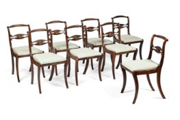 A SET OF EIGHT REGENCY SIMULATED ROSEWOOD AND BRASS MOUNTED DINING CHAIRS, CIRCA 1820