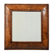 A WILLIAM & MARY WALNUT CUSHION MIRROR, CIRCA 1690