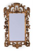 A CARVED GILTWOOD MIRROR, POSSIBLY IRISH, 19TH CENTURY
