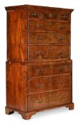 A GEORGE II FIGURED WALNUT AND FEATHER BANDED CHEST ON CHEST, CIRCA 1740