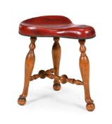 A BEECH AND LEATHER SADDLE SEATED STOOL, 20TH CENTURY