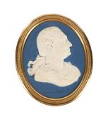 A WEDGWOOD & BENTLEY GILT-METAL MOUNTED PALE-BLUE SOLID JASPER OVAL PORTRAIT PLAQUE OF DAVID GARRICK
