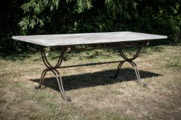 A MARBLE TOPPED GARDEN TABLE