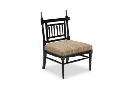 A LATE VICTORIAN AESTHETIC MOVEMENT EBONISED SIDECHAIR