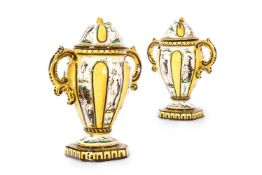 A PAIR OF EARTHENWARE TWIN HANDLED AND LIDDED COVERED VASES, ITALIAN