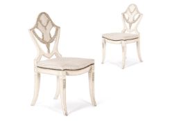 A PAIR OF CREAM AND GREY PAINTED SIDE CHAIRS IN THE GEORGE III STYLE