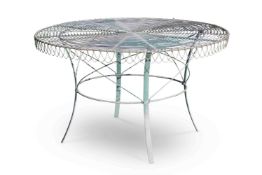 A CIRCULAR GREEN PAINTED WROUGHT IRON GARDEN TABLE, ATTRIBUTED TO ROBIN EDEN