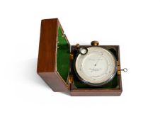 AN OXIDISED BRASS-SURVEYOR’S ANEROID BAROMETER WITH ALTIMETER SCALE AND MAHOGANY BOX