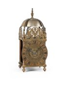 A RARE WILLIAM AND MARY BRASS TWO-HANDED LANTERN CLOCK
