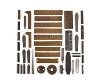 A COLLECTION OF WATCHMAKER’S SCREW PLATES, WIRE DRAW TOOLS, WHEEL SIZERS AND RELATED ITEMS
