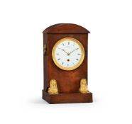 A FRENCH EMPIRE GILT BRASS MOUNTED MAHOGANY MANTEL TIMEPIECE IN THE MANNER OF ANTIDE JANVIER