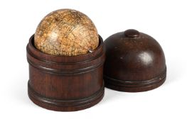 A 2.75 INCH TERRESTRIAL POCKET GLOBE IN A TURNED MAHOGANY CUPOLA-SHAPED CASE