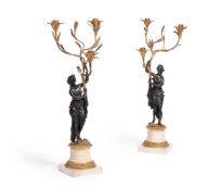A PAIR OF DIRECTOIRE GILT AND PATINATED BRONZE THREE LIGHT FIGURAL CANDELABRA, EARLY 19TH CENTURY