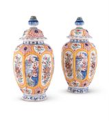A PAIR OF DUTCH DELFT POLYCHROME VASES AND COVERS 19TH CENTURY Each with panels of Chinoiserie sty