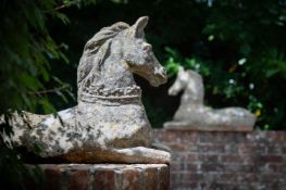 A PAIR OF STONE COMPOSITION MODELS OF RECUMBENT HORSES, MID 20TH CENTURY