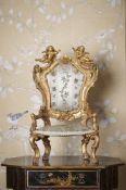 AN UNUSUAL ITALIAN CARVED GILTWOOD MINIATURE ARMCHAIR, EARLY 18TH CENTURY