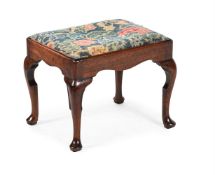 A GEORGE II WALNUT AND NEEDLEWORK STOOL, CIRCA 1730