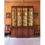 A GEORGE III MAHOGANY, SATINWOOD CROSSBANDED AND LINE INLAID BREAKFRONT BOOKCASE, CIRCA 1765