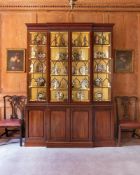 A GEORGE III MAHOGANY, SATINWOOD CROSSBANDED AND LINE INLAID BREAKFRONT BOOKCASE, CIRCA 1765