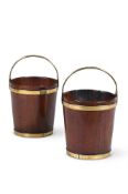 A PAIR OF GEORGE III MAHOGANY AND BRASS BOUND BUCKETS, CIRCA 1770