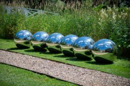 A SET OF SIX LARGE STAINLESS STEEL SPHERES, CONTEMPORARY