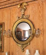 A REGENCY GILTWOOD CONVEX MIRROR, IN THE MANNER OF THOMAS FENTHAM, CIRCA 1815