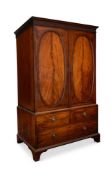 A GEORGE III FIGURED MAHOGANY CLOTHES PRESS, CIRCA 1780