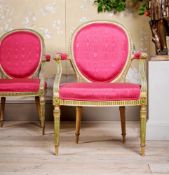 A PAIR OF GEORGE III CREAM AND GREEN PAINTED OPEN ARMCHAIRS, CIRCA 1790