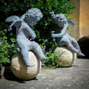 A PAIR OF GEORGE III STYLE LEAD 'BACCHANALIAN' CHERUBS, CONTEMPORARY