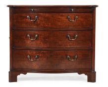 A GEORGE III MAHOGANY SERPENTINE COMMODE, IN THE MANNER OF THOMAS CHIPPENDALE, CIRCA 1770