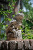 A STONE COMPOSITION MODEL OF AN OWL WITH A MOUSE IN ITS BEAK, MID 19TH CENTURY