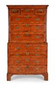 A GEORGE II WALNUT, FEATHER AND CROSSBANDED SECRETAIRE CHEST ON CHEST, CIRCA 1740