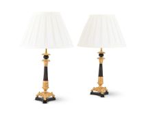 A PAIR OF BRONZE AND PARCEL GILT TRIFORM CANDLESTICK LAMP BASES, MID 19TH CENTURY