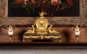 A GILT AND PATINATED BRONZE MANTEL TIMEPIECE19TH CENTURY
