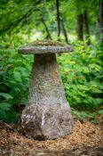 A MONUMENTAL PURBECK STONE SADDLE STONE, 18TH CENTURY