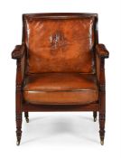 A REGENCY MAHOGANY AND CANED LIBRARY BERGERE ARMCHAIR, IN THE MANNER OF GILLOWS, CIRCA 1815
