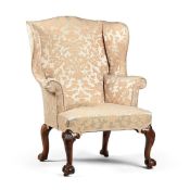 A GEORGE II WALNUT WING BACK ARMCHAIR, CIRCA 1735