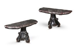 A PAIR OF ITALIAN CARVED AND EBONISED OAK CONSOLE TABLES, MID 19TH CENTURY