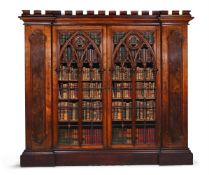 A VICTORIAN GOTHIC REVIVAL OAK AND POLLARD OAK INVERTED BREAKFRONT BOOKCASE CABINET, CIRCA 1880