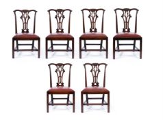A SET OF SIX GEORGE III CARVED 'RED WALNUT' SIDE CHAIRS, CIRCA 1760