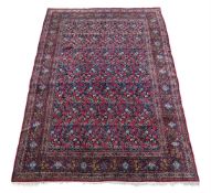 † A PERSIAN CARPET, CIRCA 1900