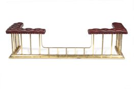 A POLISHED BRASS AND MAROON LEATHER UPHOLSTERED CLUB FENDER, 20TH CENTURY