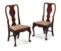A PAIR OF GEORGE II CARVED WALNUT CHAIRS, CIRCA 1740